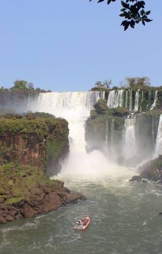a large waterfall over a body of water