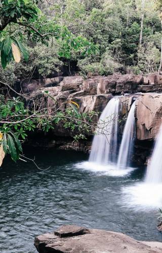 a large waterfall over some water