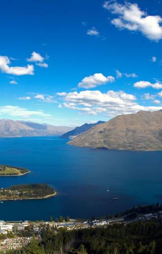 a view of a body of water with a mountain in the background