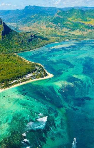 An aerial view of Mauritius, Le Morne Brabant mountain, and the underwater waterfall