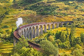 Glenfinnan Railway Viaduct with Jacobite Steam Train
