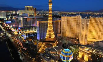 a lit up city at night with Las Vegas Strip in the background