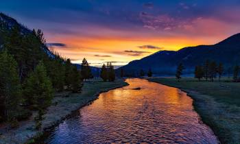 a sunset over a body of water