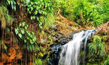 a large waterfall over a body of water