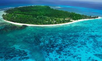 Aerial view of Denis Island Seychelles surrounded by blue sea waters