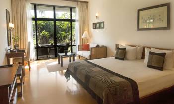 a bedroom with a large bed in a hotel room