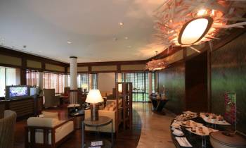 a living room filled with furniture and a large window