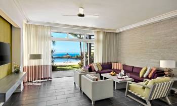 a living room filled with furniture and a large window