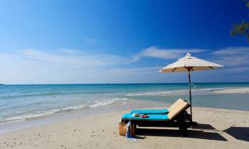 an umbrella sitting on top of a beach