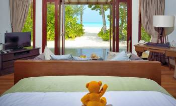 a hotel room with a bed and a window