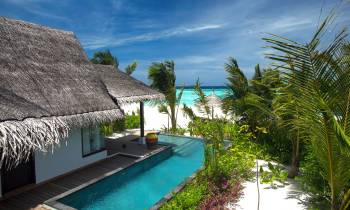 a house with a large pool of water