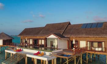 a wooden dock in front of a house