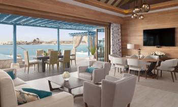 a living room filled with furniture and a large window