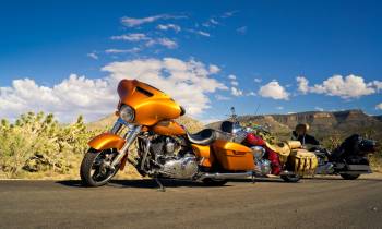 a motorcycle parked on the side of a road