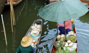 a group of people on a boat in the water