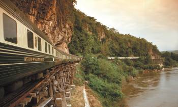 a train crossing a bridge over a river