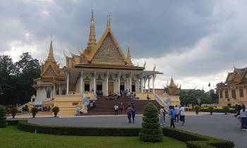 a statue in front of Royal Palace, Phnom Penh