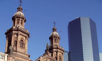 a group of people walking in front of a large church