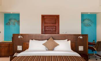 a bedroom with a bed in a room