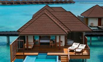a house with a pool of water
