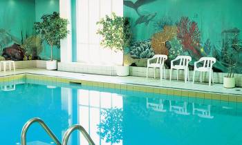 a pool next to a building