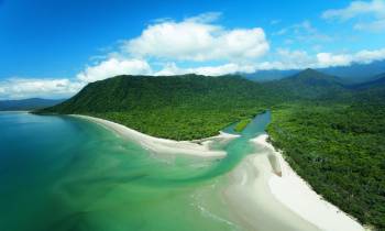 a body of water with Cape Tribulation, Queensland in the background