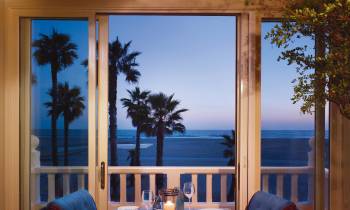 a dining room table in front of a window