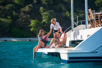 Couple having drinks while sailing