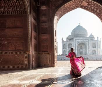 Lady standing near Taj Mahal, Agra, India - Best Time to Visit India