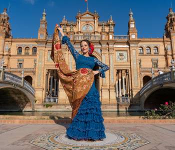 Typical Spanish woman dancing flamenco in Seville, Andalusia, Spain.-min