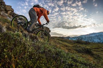 A man riding down a mountain in Greenland.