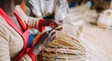 woman-weaving-basket-rwanda-africa