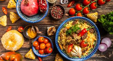 Assorted Uzbek and central asia food pilaf samsa lagman manti shurpa