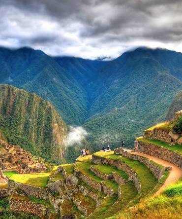 Enchanting Travels Peru Tours - Panoramic HDR image of Machu Picchu, the lost city of the Incas on a cloudy day. Machu Picchu is one of the new 7 Wonder of the Word near Cusco