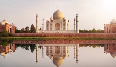 Sun set at Taj Mahal seen from Mehtab Bagh reflect on Yamuna river, an ivory-white marble mausoleum on the south bank of the Yamuna river in Agra, Uttar Pradesh, Enchanting Travels India tours