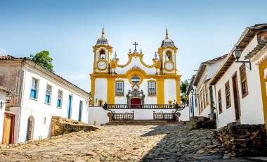 Colorful colonial houses and church in city of Tiradentes