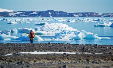 Enchanting Travels Arctic Tours - Man viewing ice floes