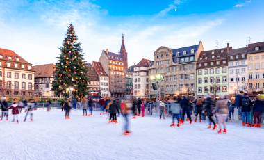 Enchanting Travels France Tours Ice Skating near the Cathedral in Strasbourg