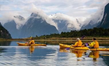 Enchanting Travels New Zealand Tours sea kayak in Milford Sound, New Zealand