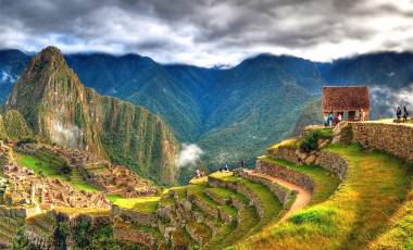 Enchanting Travels Peru Tours - Panoramic HDR image of Machu Picchu, the lost city of the Incas on a cloudy day. Machu Picchu is one of the new 7 Wonder of the Word near Cusco