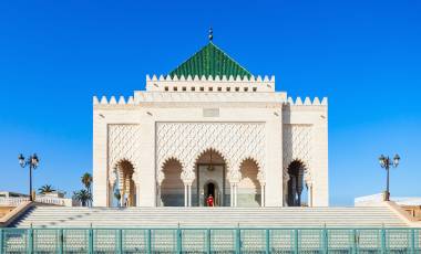 The Mausoleum of Mohammed V is a historical building located on the opposite side of the Hassan Tower on the Yacoub al-Mansour esplanade in Rabat, Morocco