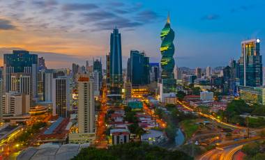 The colorful panoramic skyline of Panama City at sunset with high rise skyscrapers, Panama, Central America.The colorful panoramic skyline of Panama City at sunset with high rise skyscrapers, Panama, Central America.