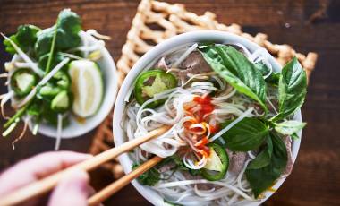 vietnamese pho with spicy sriracha sauce shot top down