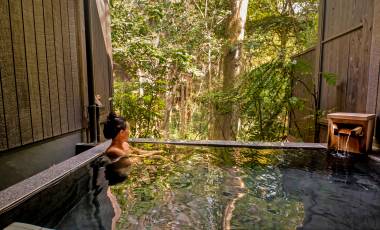 Peaceful Asian Woman in Onsen luxury spa vacation