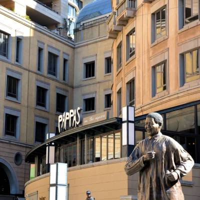 a man standing in front of a building