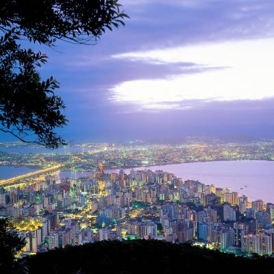 a view of a large body of water with a city in the background