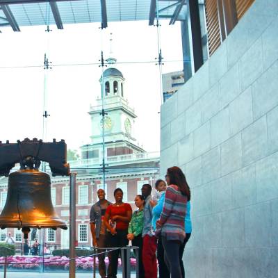 a group of people standing in front of a building