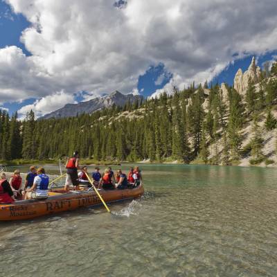 a group of people riding on the back of a boat