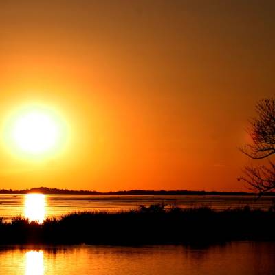 a sunset over a body of water