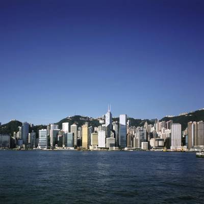 a large body of water with a city in the background